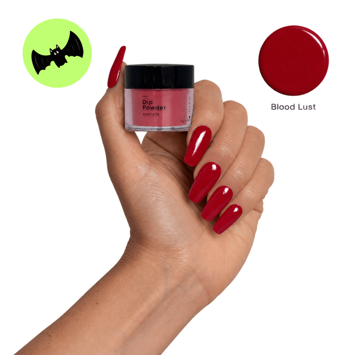 Blood Lust Dip Nail Red nails holding the colour pot and swatch for DIPD Nails