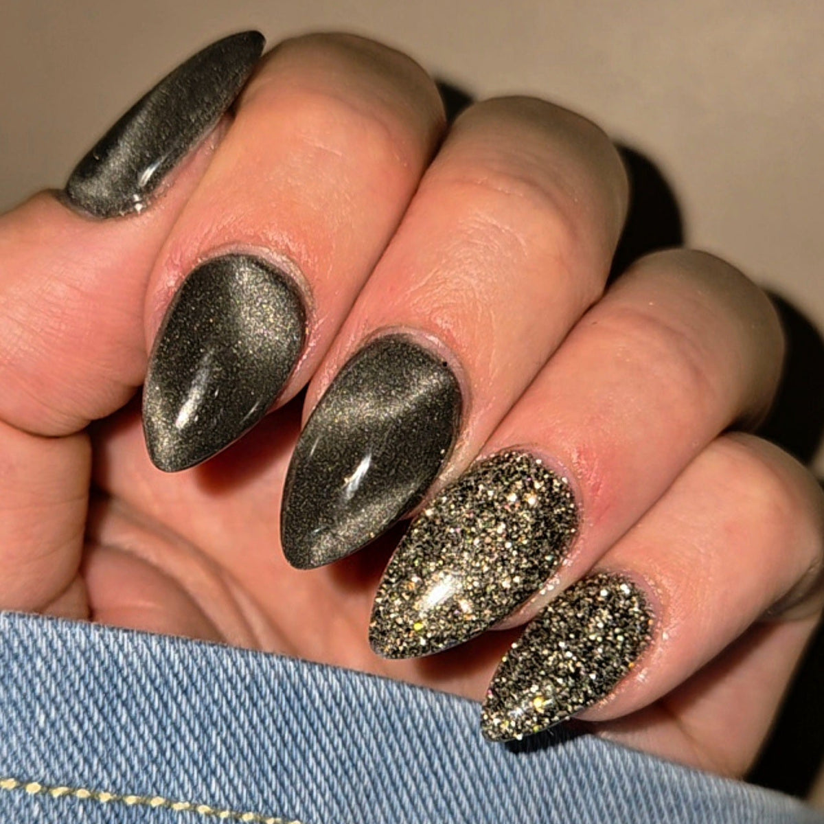 galaxy glow cat eye ip powder in a dark grey colour matched with Steel Aurora glitter dip powder