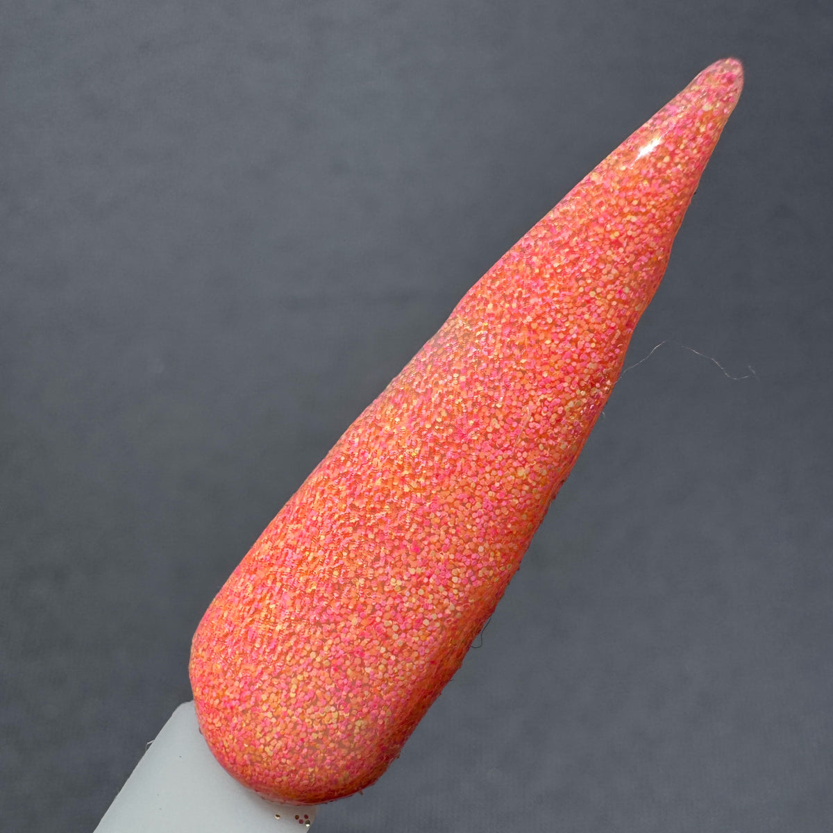 gerbera suede neon orange dip powder in a swatch