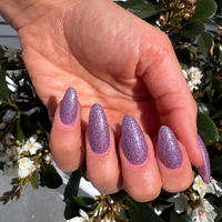 iris purple glitter from modern goddess collection on natural nails.