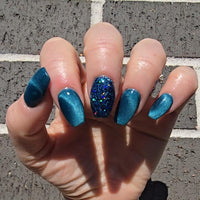 Natural nails with new cat eye Norther lights magnetic dip powder colour and stardust navy glitter