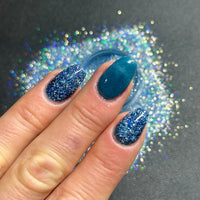 Stardust Navy glitter dip powder form celestial collection by DIPD Nails. Applied to natural nails using the pro liquids