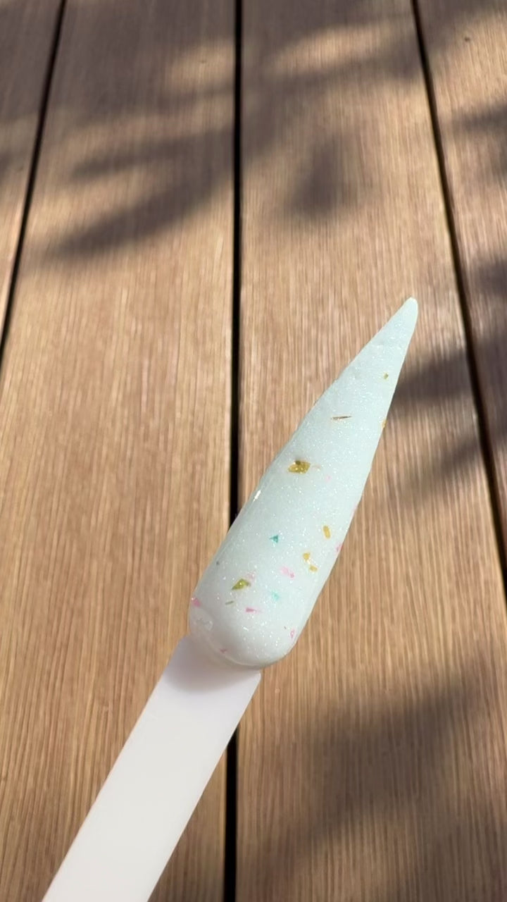 Sage Bloom Glitter from Confetti Milk Collection by DIPD Nails on a Stiletto Swatch